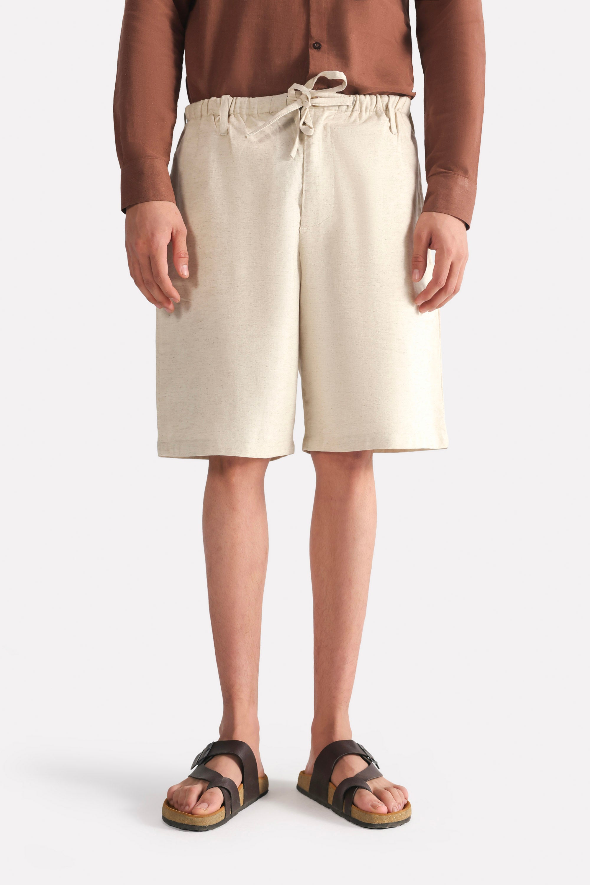 Beige linen drawstring shorts, full styled look, by SOLA Pakistan.