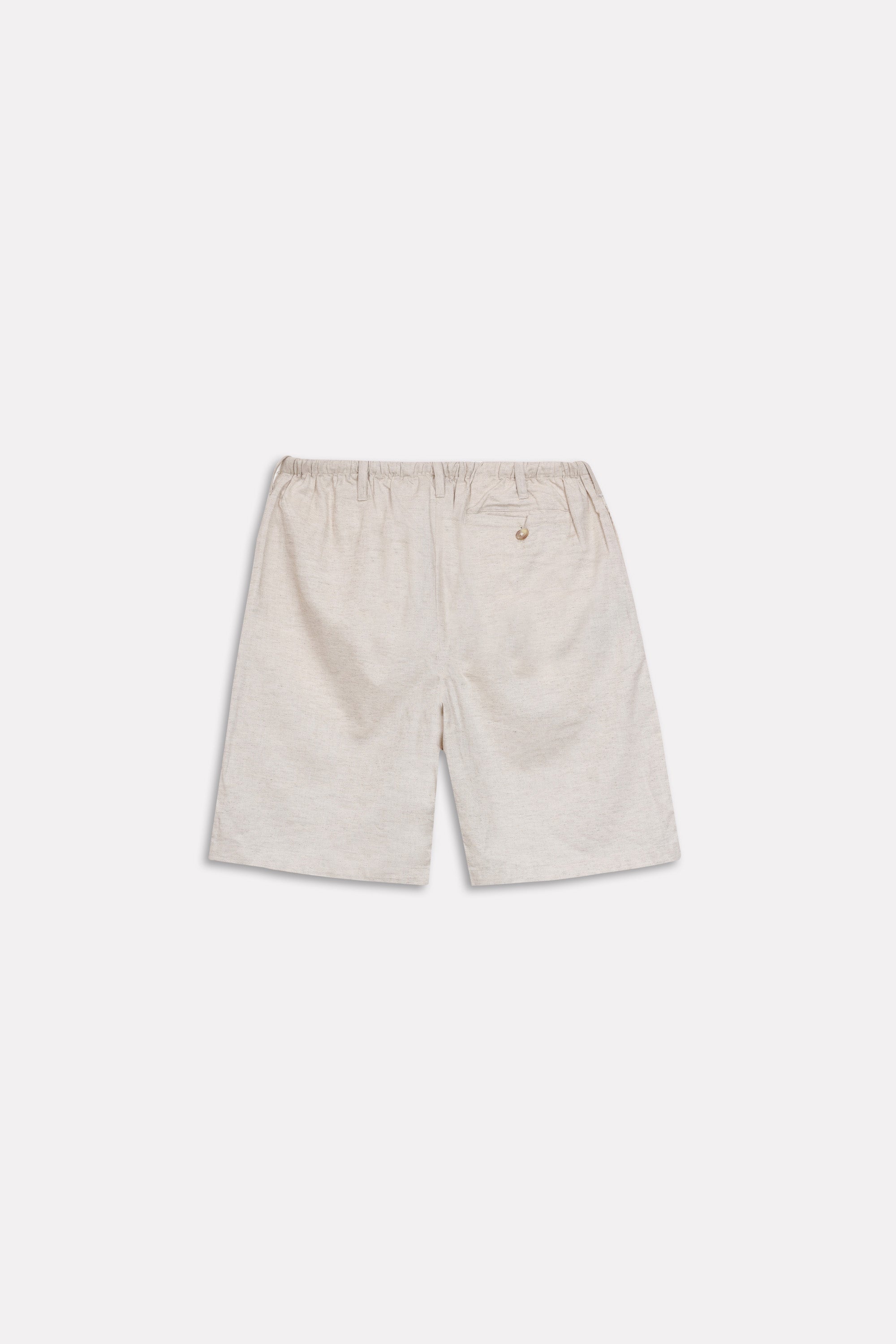 Texture and fabric detail, beige linen drawstring shorts, by SOLA Pakistan.