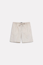 Texture and fabric detail, beige linen drawstring shorts, by SOLA Pakistan.