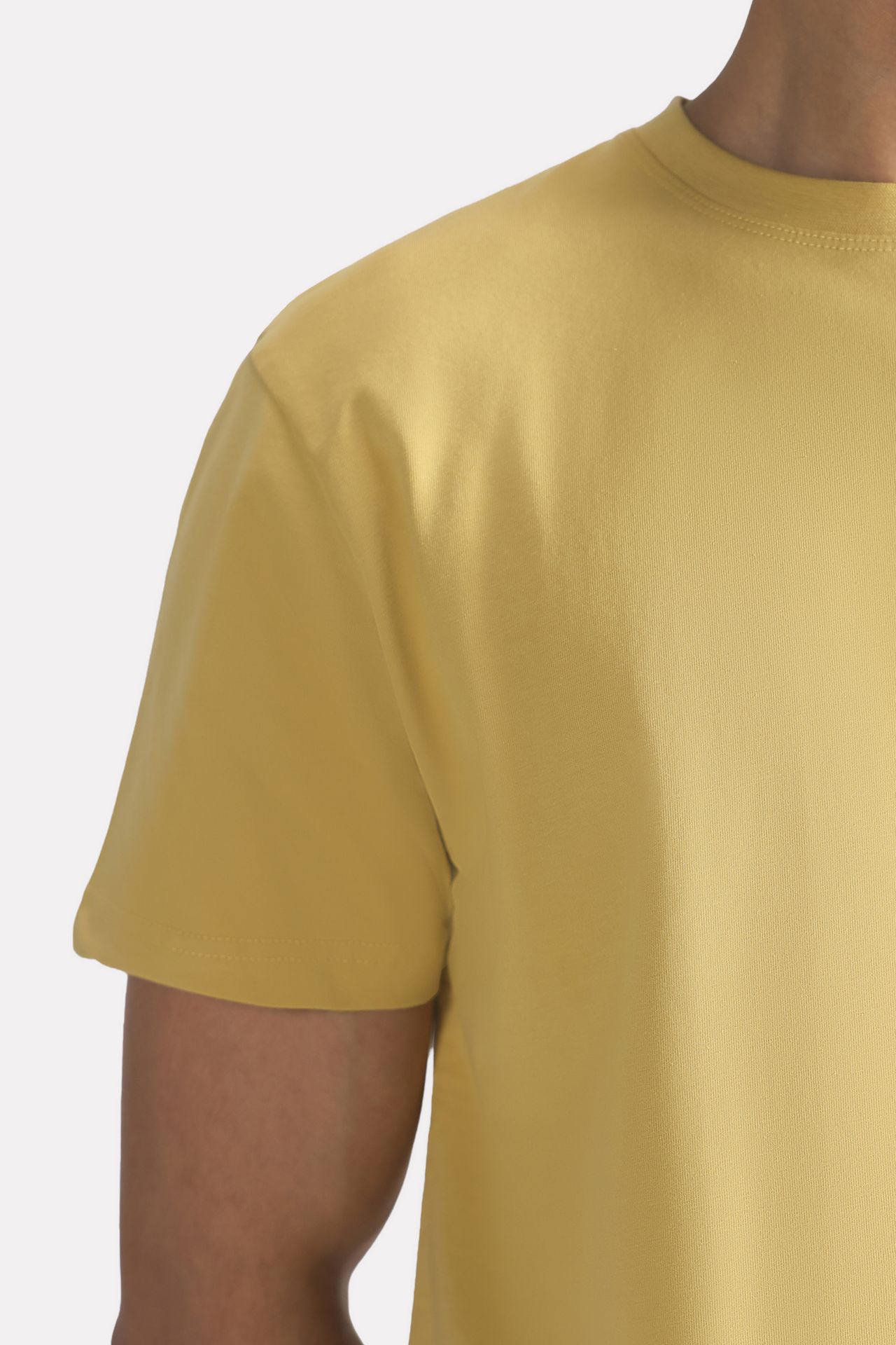 Flat lay of the beige regular fit crew neck t-shirt, by SOLA Pakistan.