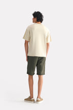 Flat lay of the beige (sand) drop shoulder cotton t-shirt, by SOLA Pakistan.