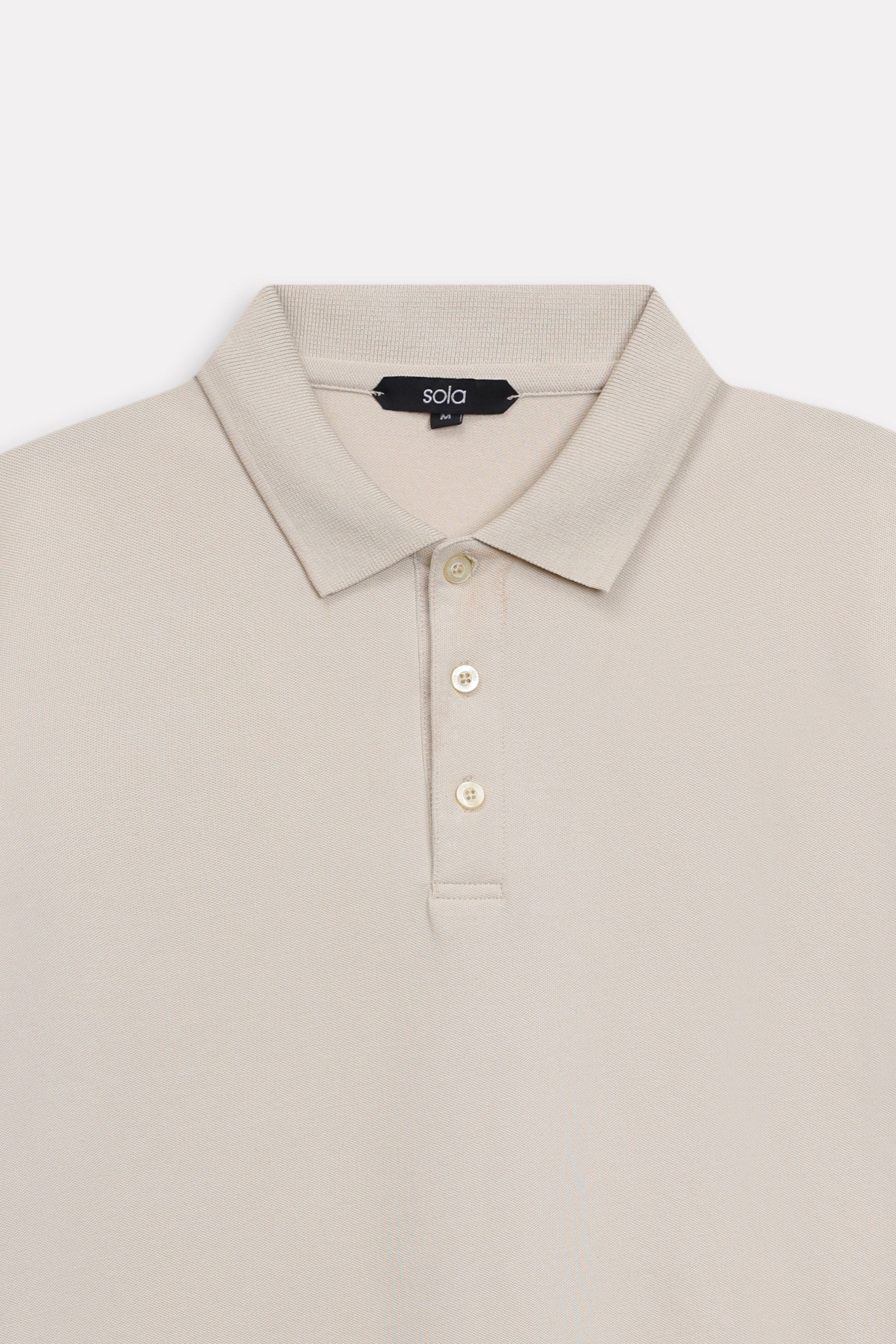 Additional view of the beige (sand) micro-textured cotton pique polo, by SOLA Pakistan.