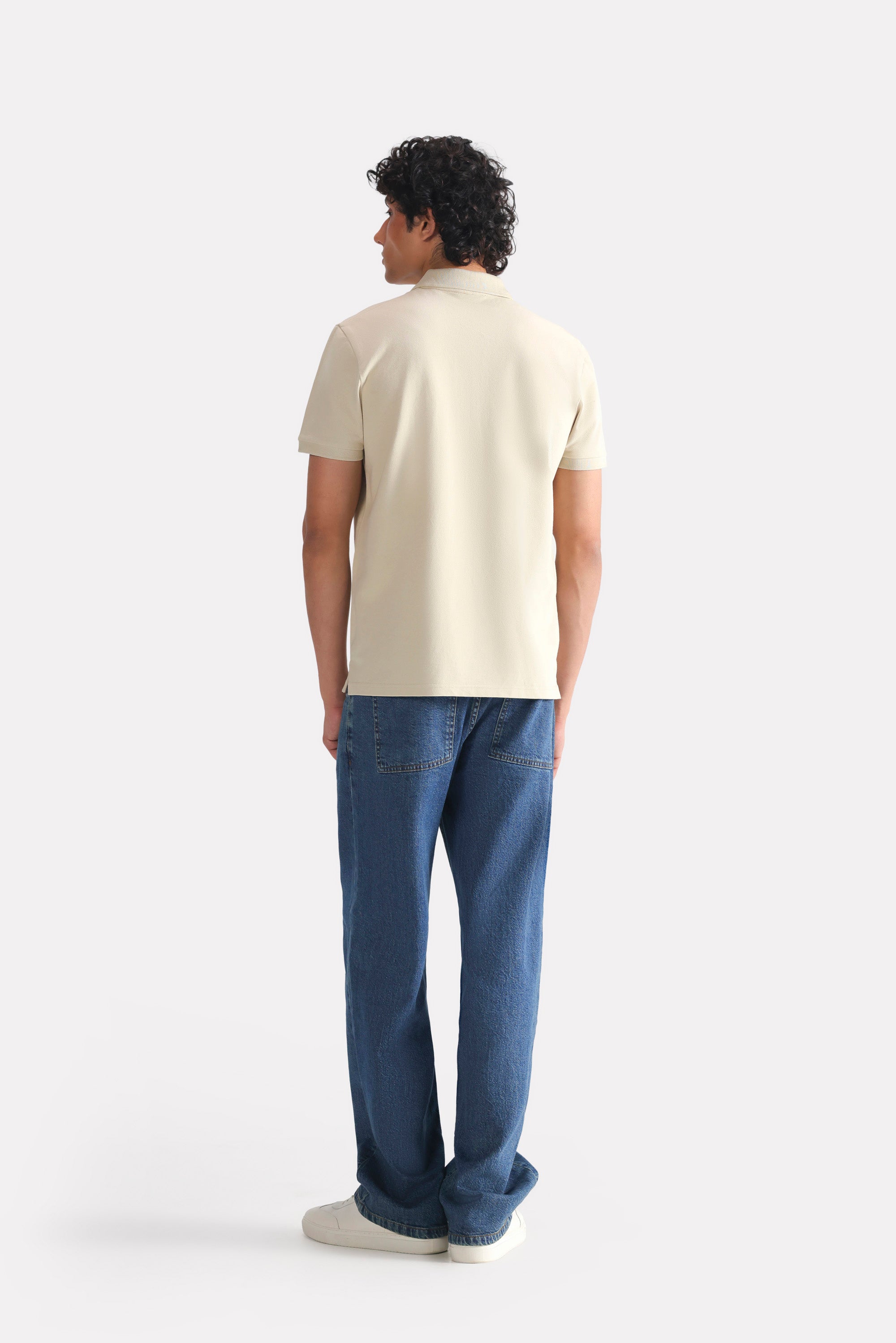 Beige (sand) micro-textured cotton pique polo, alternate angle, by SOLA Pakistan.