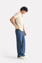 Beige (sand) micro-textured cotton pique polo, full styled look, by SOLA Pakistan.