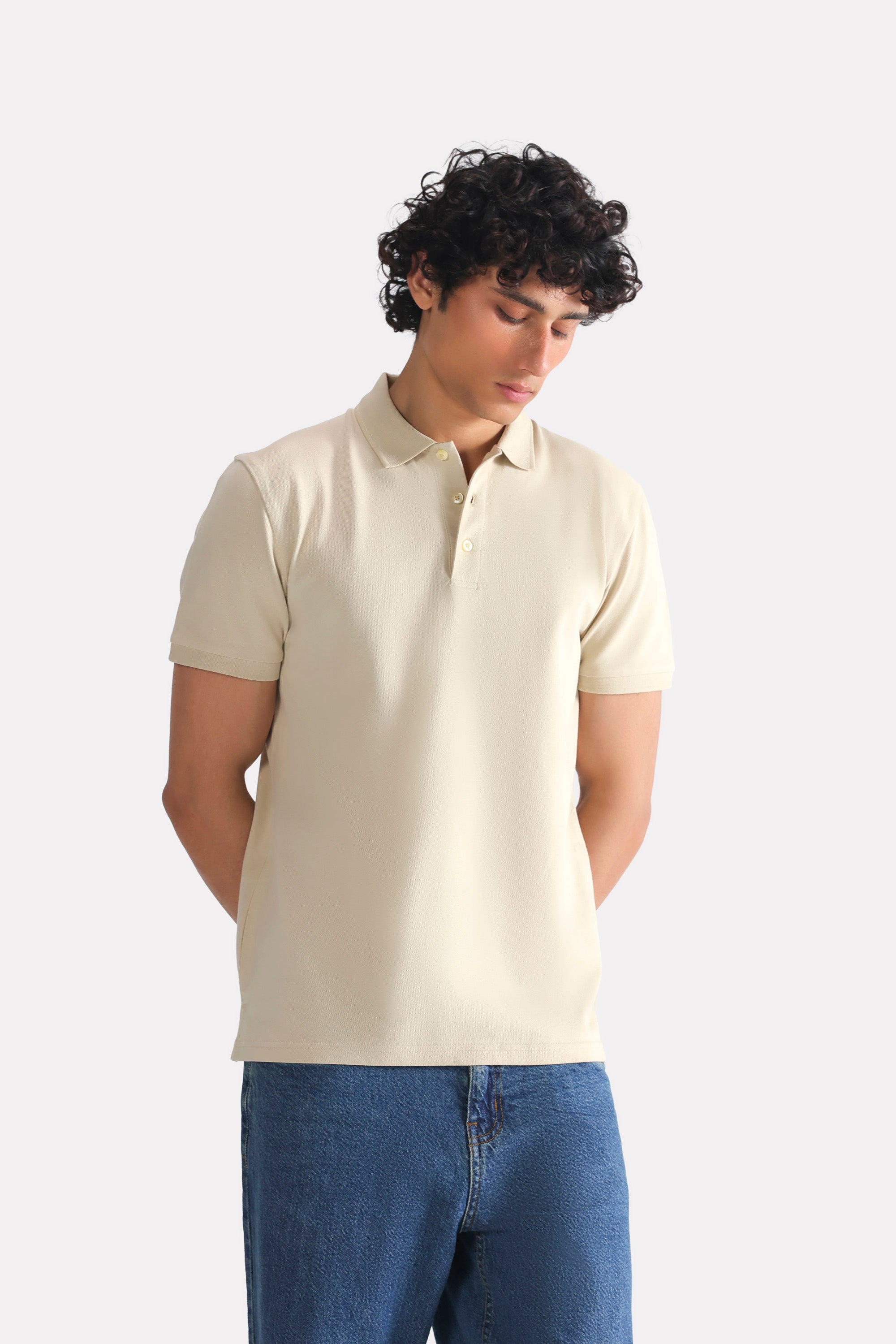 Beige (sand) micro-textured cotton pique polo shown in a styled fit, by SOLA Pakistan.