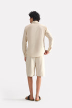 Flat lay of the beige (sand) relaxed cotline shirt, by SOLA Pakistan.