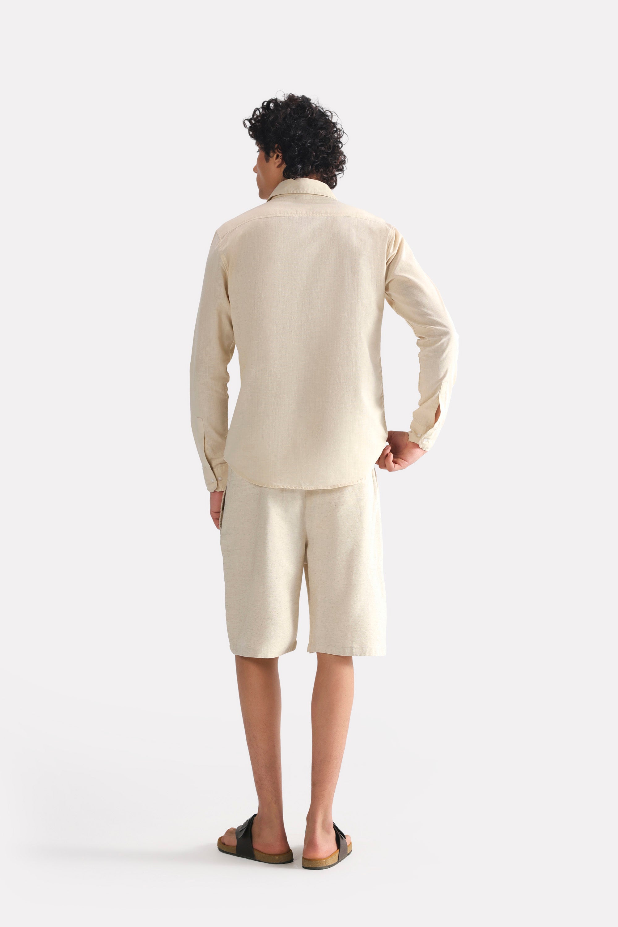 Flat lay of the beige (sand) relaxed cotline shirt, by SOLA Pakistan.