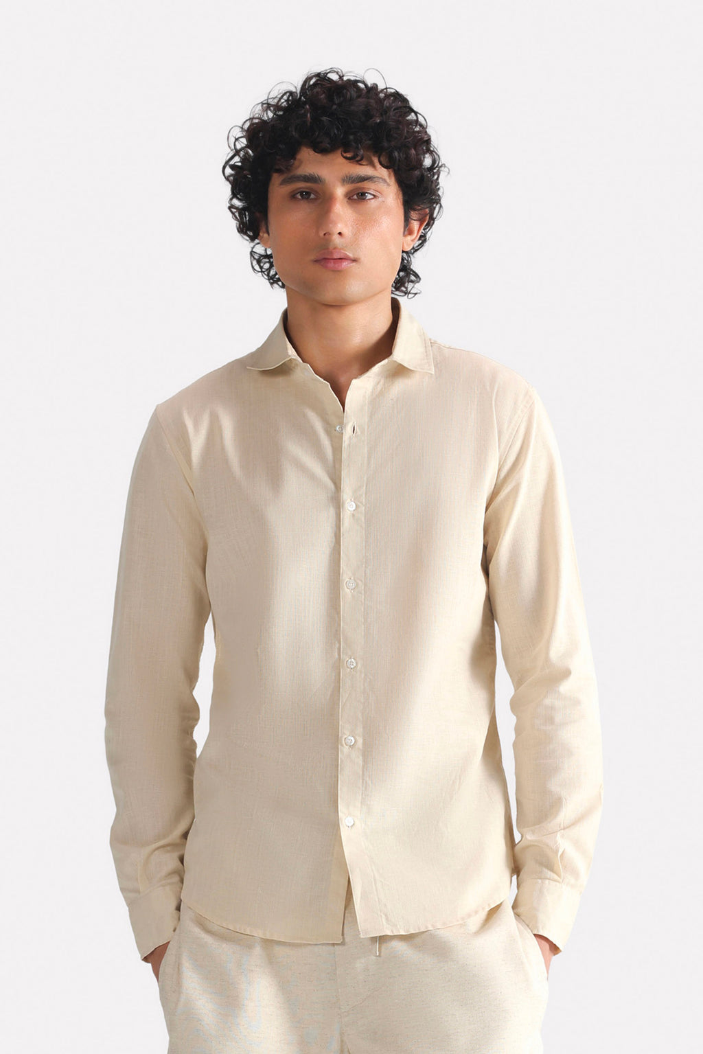 Beige (sand) relaxed cotline shirt in cotton-linen blend, worn by a model, by SOLA Pakistan.