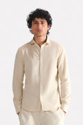 Beige (sand) relaxed cotline shirt in cotton-linen blend, worn by a model, by SOLA Pakistan.