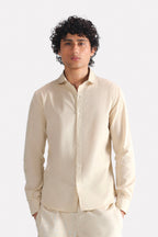 Beige (sand) relaxed cotline shirt in cotton-linen blend, worn by a model, by SOLA Pakistan.