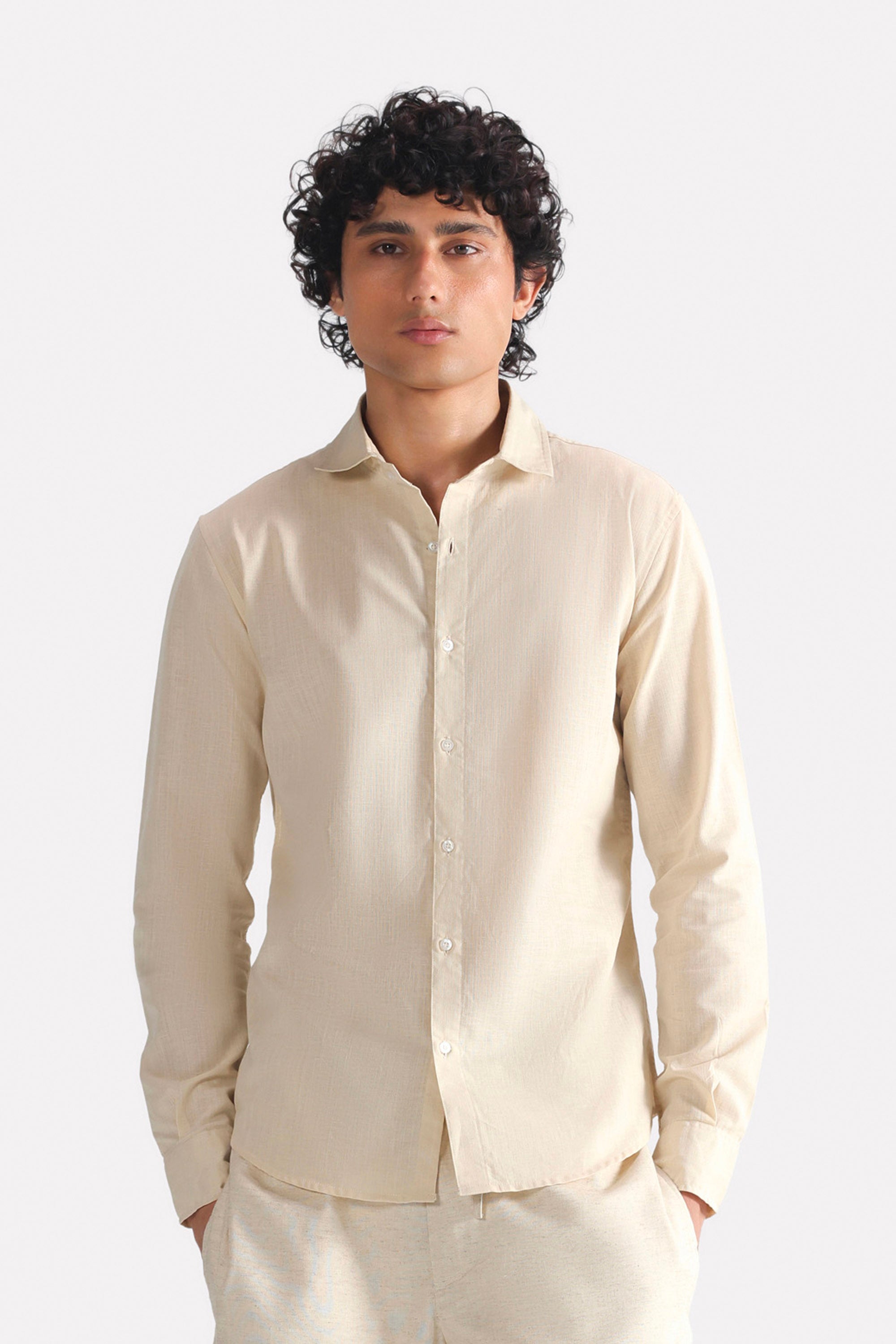 Beige (sand) relaxed cotline shirt in cotton-linen blend, worn by a model, by SOLA Pakistan.