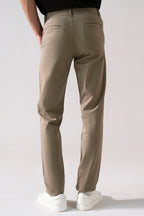 Close-up detail on the beige satin straight-fit chino, by SOLA Pakistan.