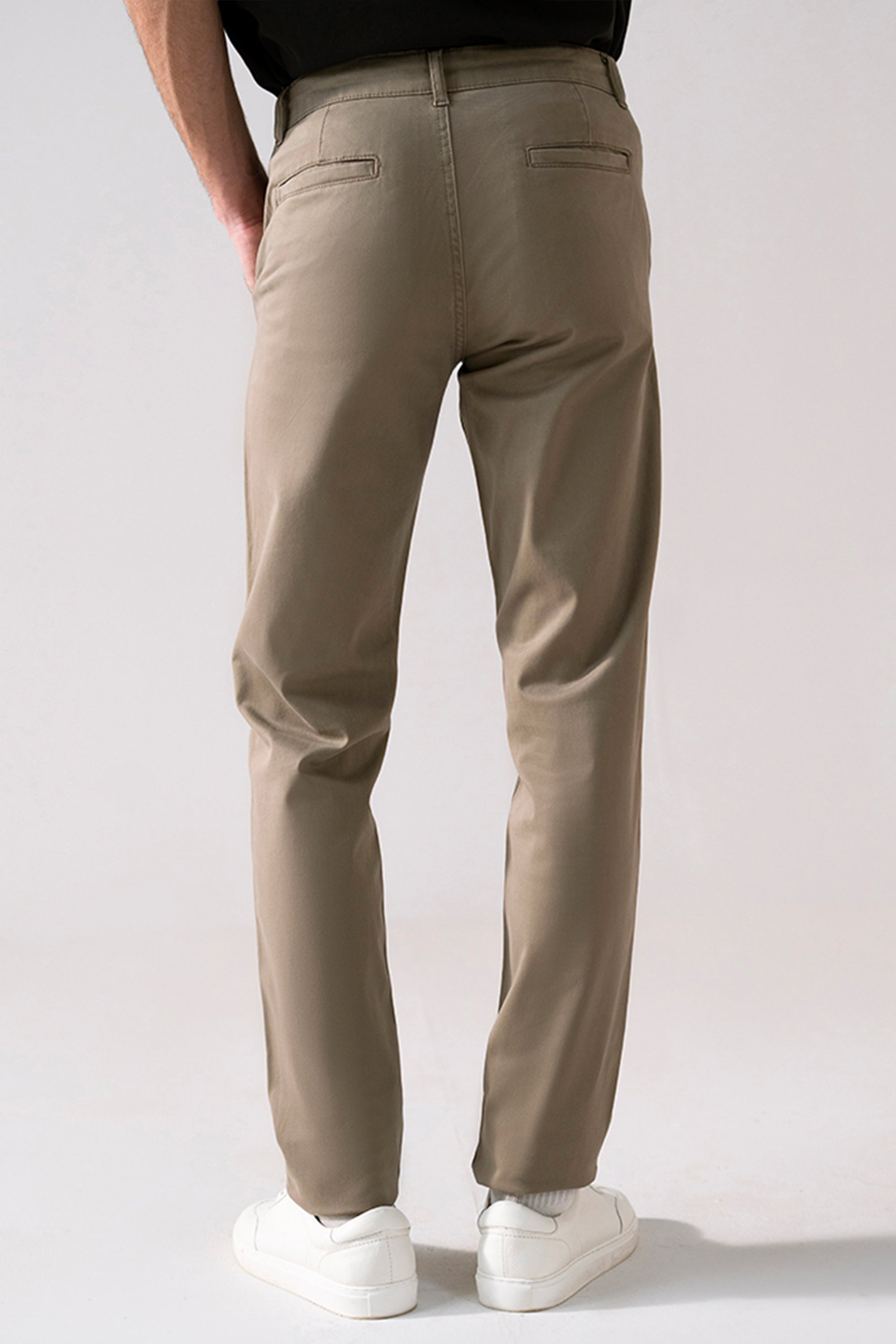 Close-up detail on the beige satin straight-fit chino, by SOLA Pakistan.