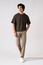 Beige satin straight-fit chino in cotton, worn by a model, by SOLA Pakistan.