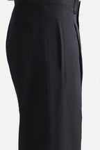 Flat lay of the black barrel-leg pleated trouser, by SOLA Pakistan.