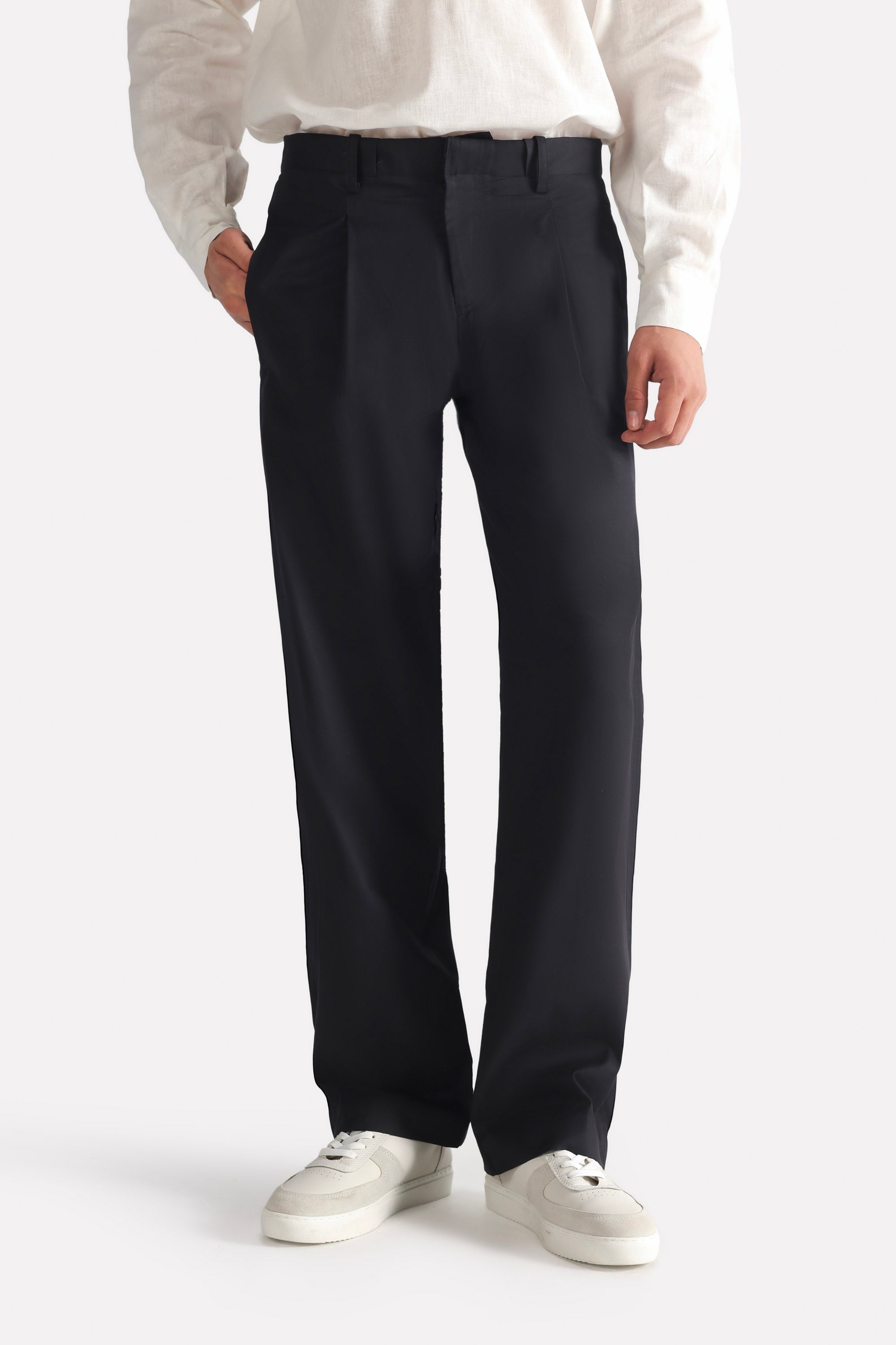 Black barrel-leg pleated trouser, full styled look, by SOLA Pakistan.