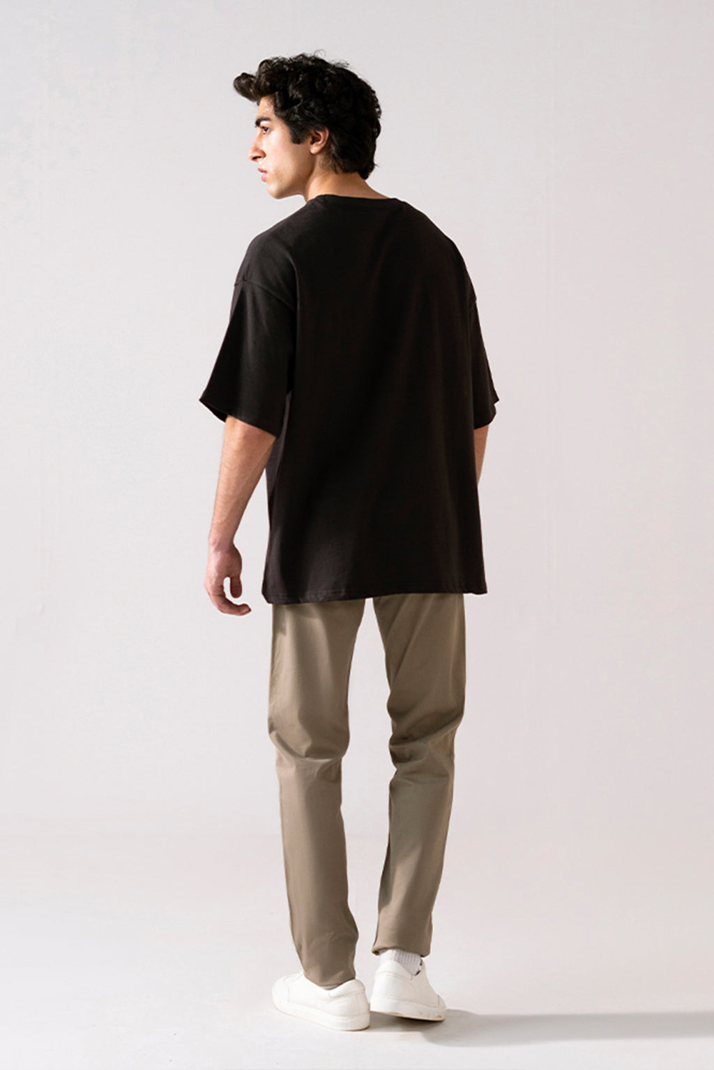 Flat lay of the black heavy weight cropped t-shirt, by SOLA Pakistan.