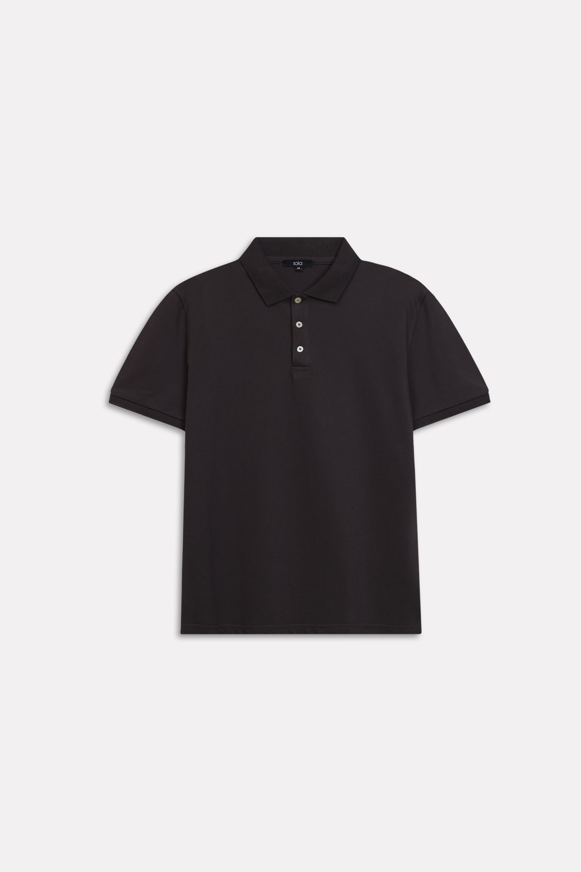 Flat lay of the black micro-textured cotton pique polo, by SOLA Pakistan.