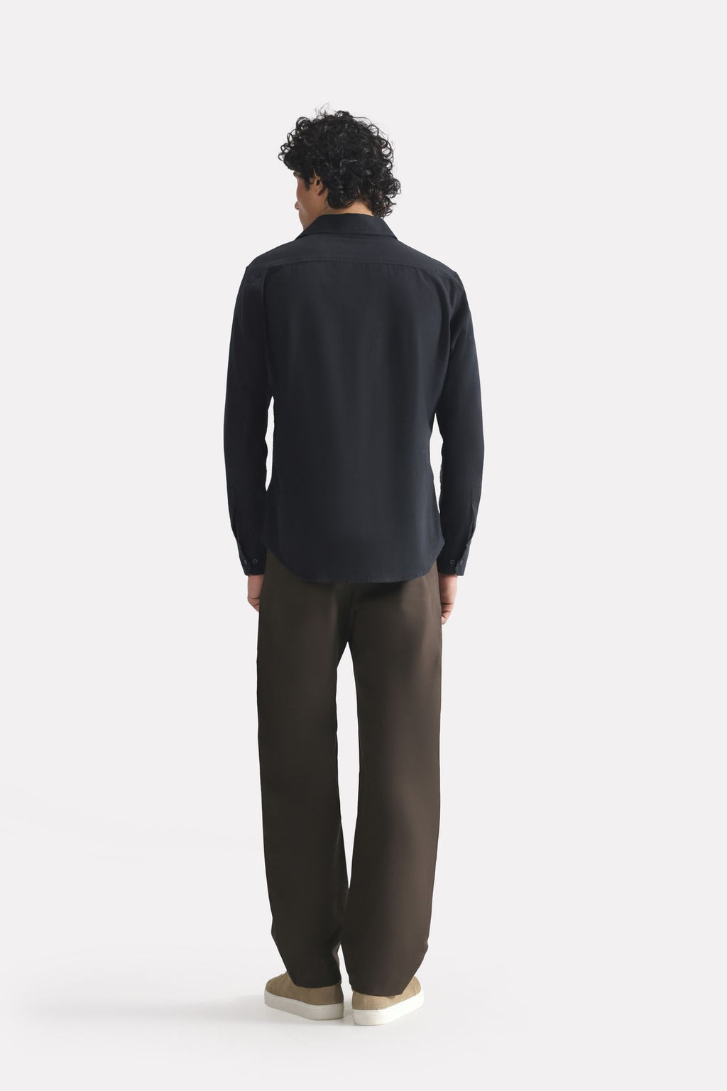 Flat lay of the black regular fit cotton shirt, by SOLA Pakistan.