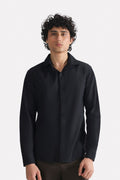 Black regular fit cotton shirt, worn by a model, by SOLA Pakistan.