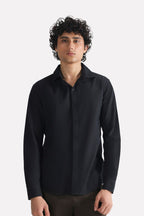 Black regular fit cotton shirt, worn by a model, by SOLA Pakistan.
