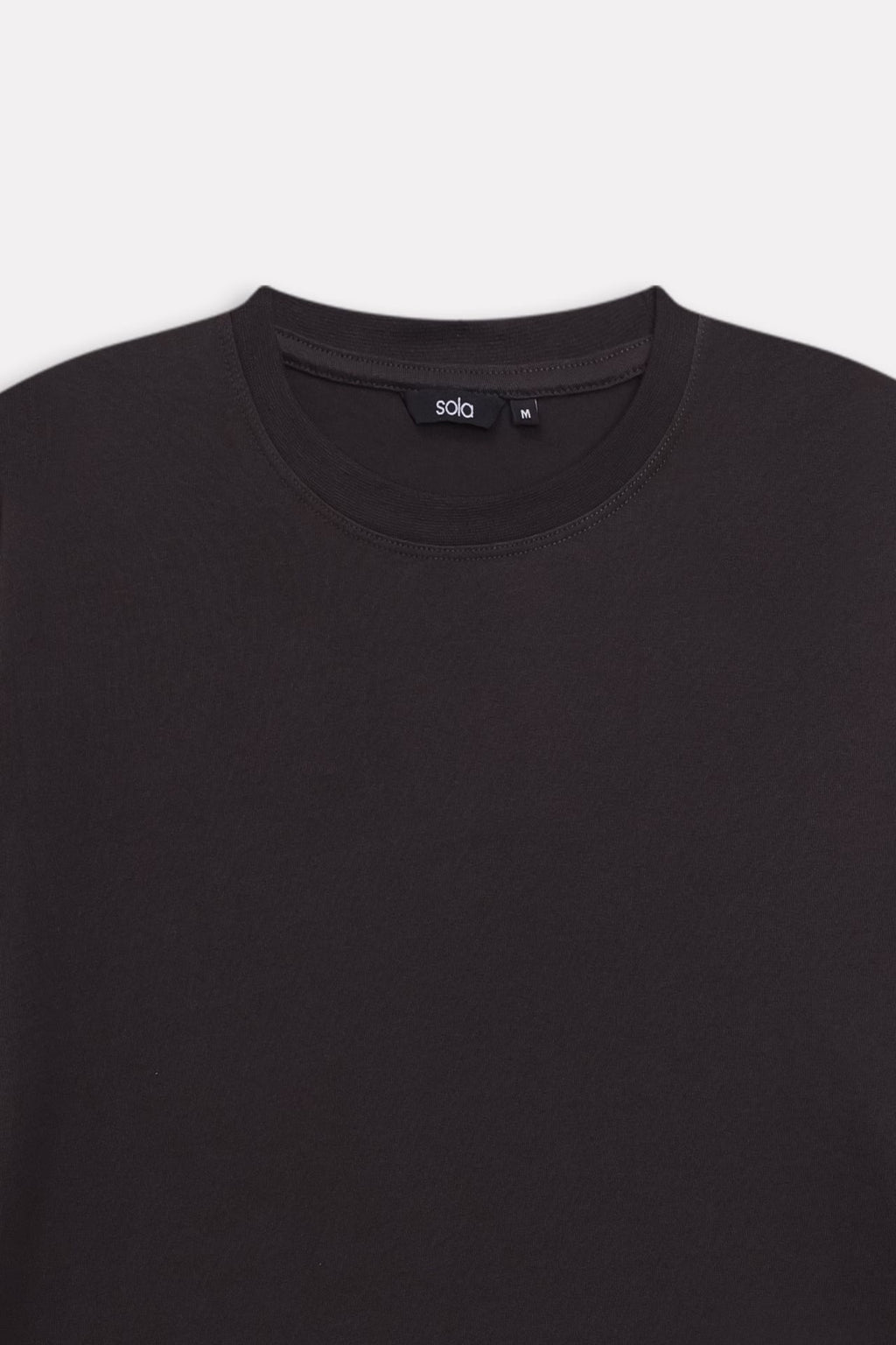 Additional view of the black regular fit crew neck t-shirt, by SOLA Pakistan.