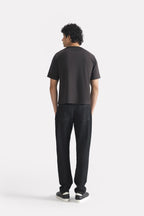 Flat lay of the black regular fit crew neck t-shirt, by SOLA Pakistan.