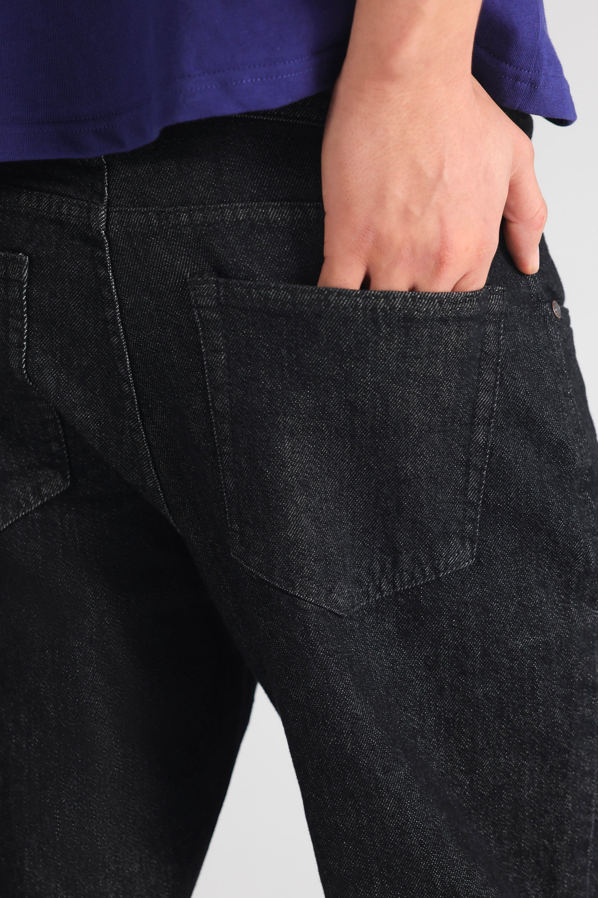 Black regular fit jean shown in a styled fit, by SOLA Pakistan.