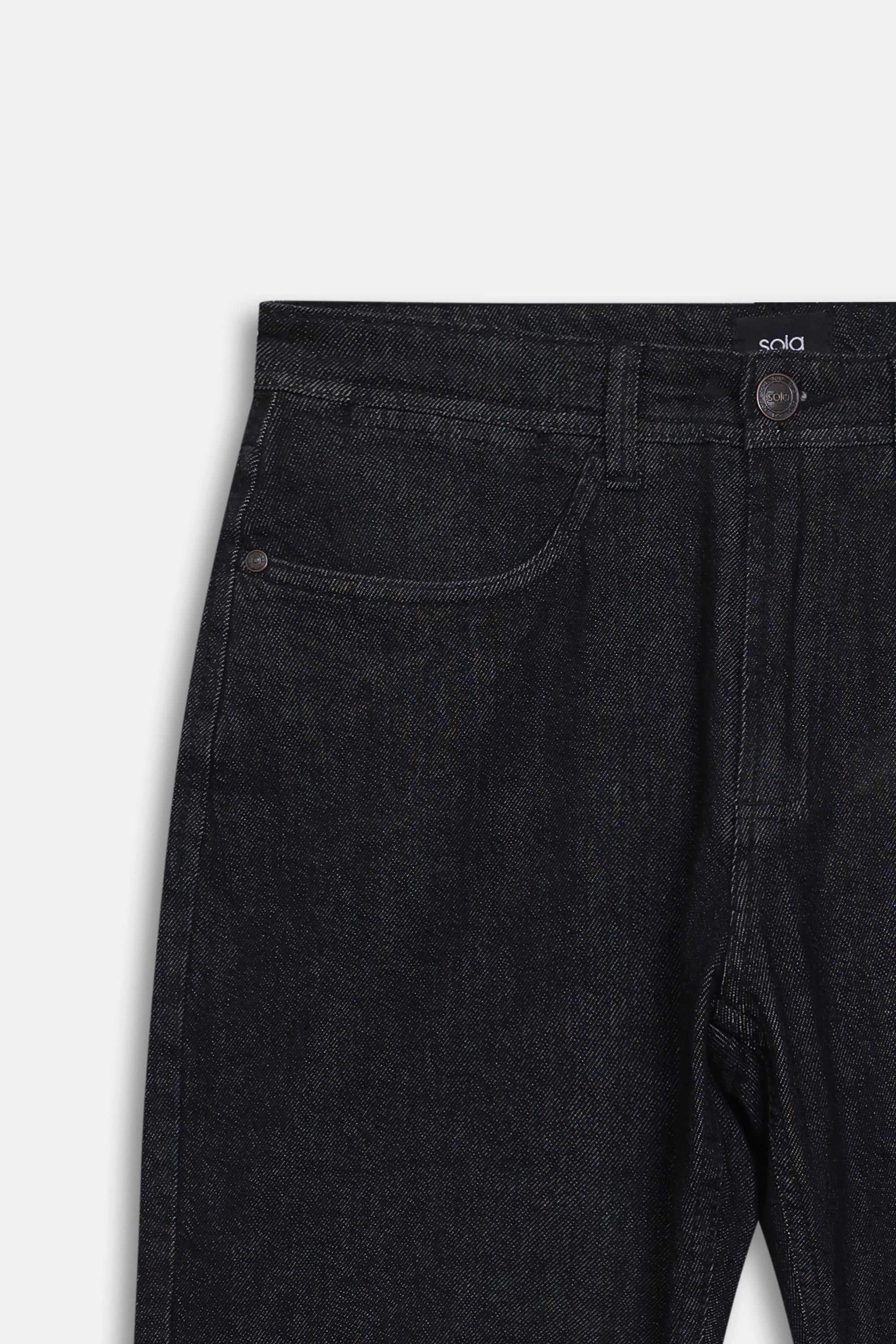Texture and fabric detail, black regular fit jean, by SOLA Pakistan.