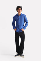 Black straight fit cotton trouser, worn by a model, by SOLA Pakistan.