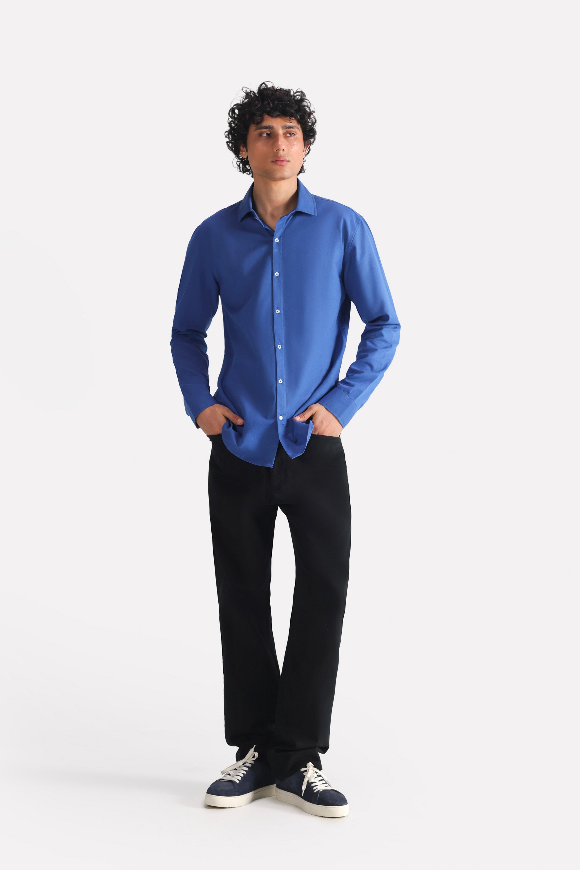 Black straight fit cotton trouser, worn by a model, by SOLA Pakistan.