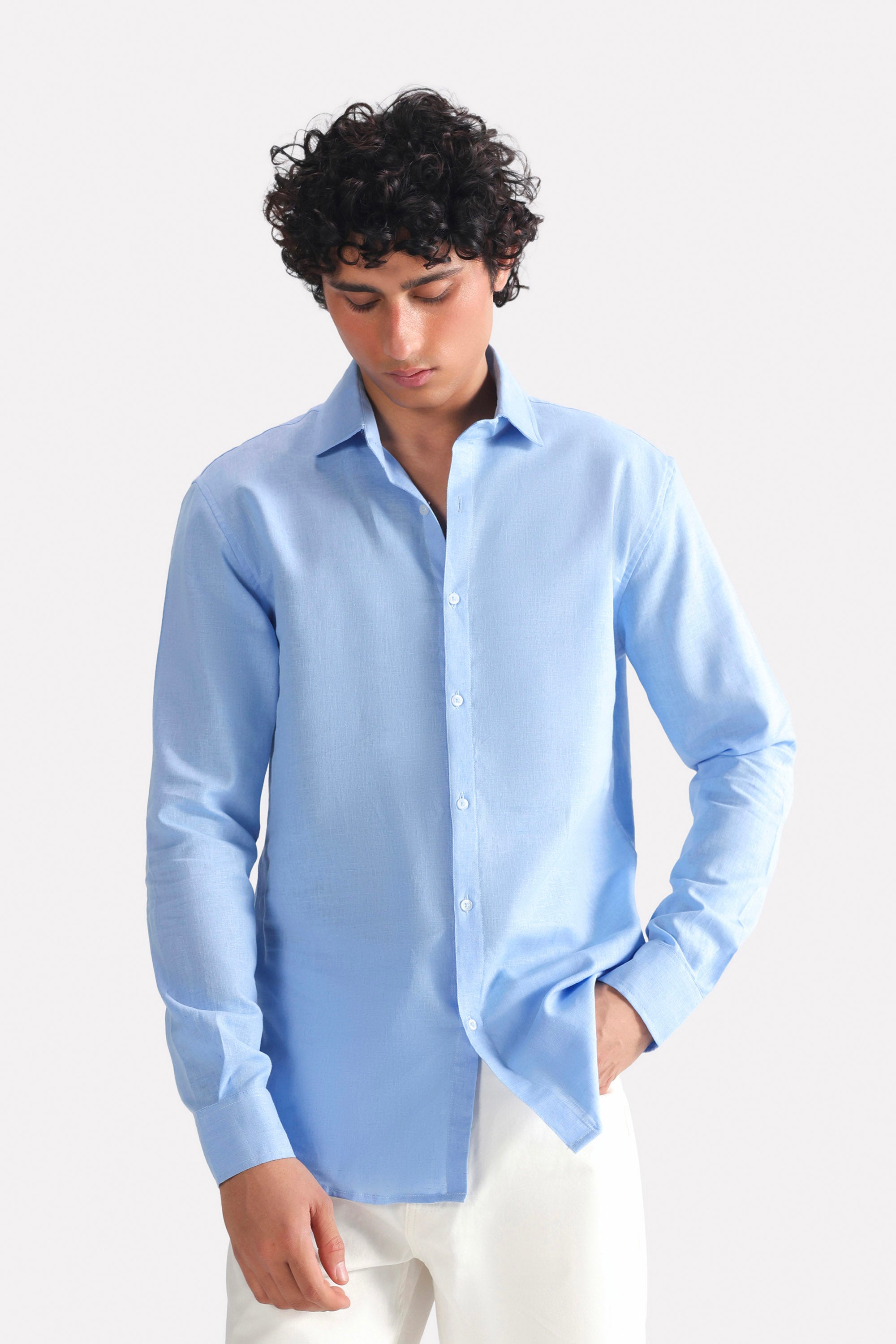 Blue (french blue) relaxed cotline shirt in cotton-linen blend, worn by a model, by SOLA Pakistan.