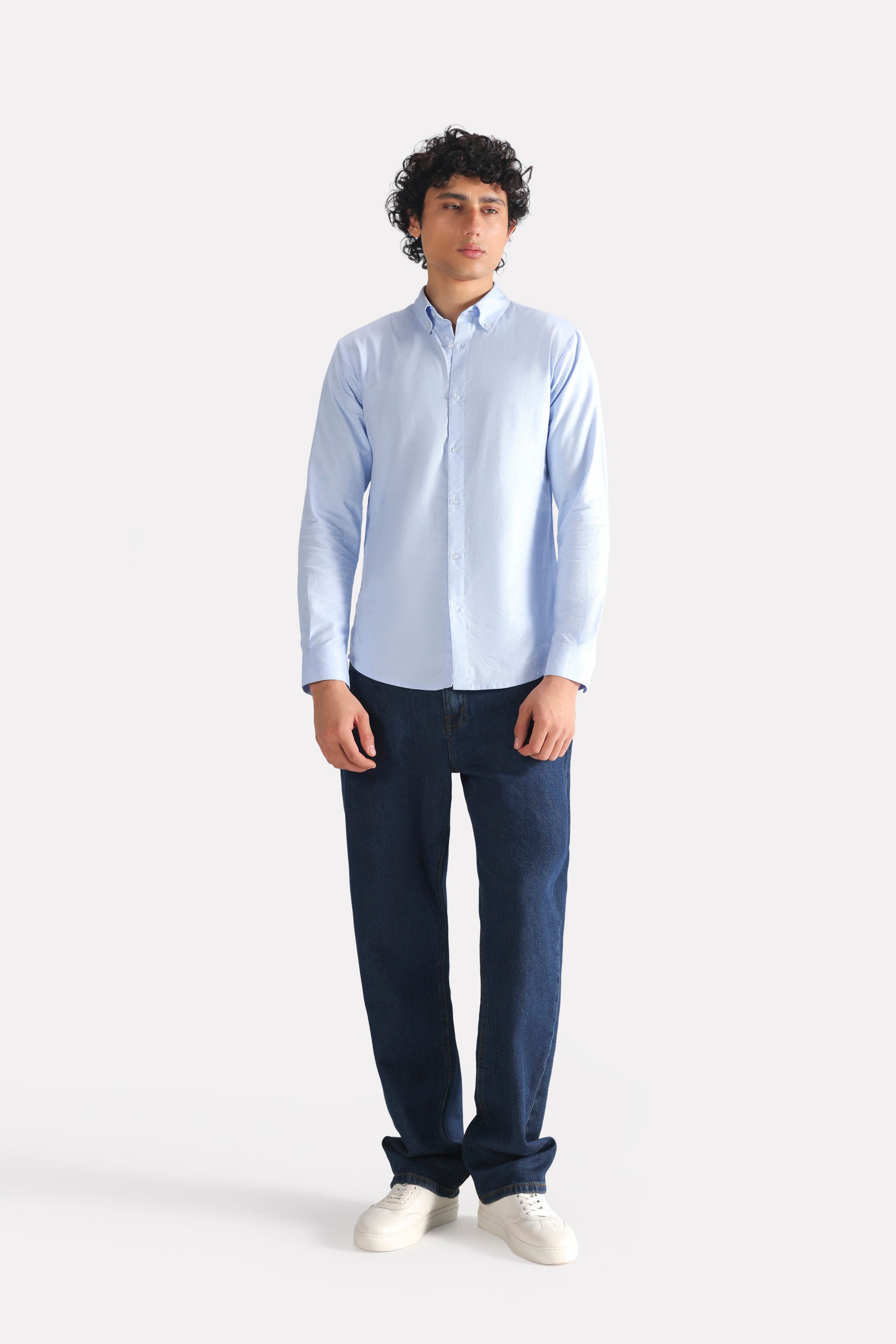 Close-up detail on the blue slim fit textured oxford shirt, by SOLA Pakistan.