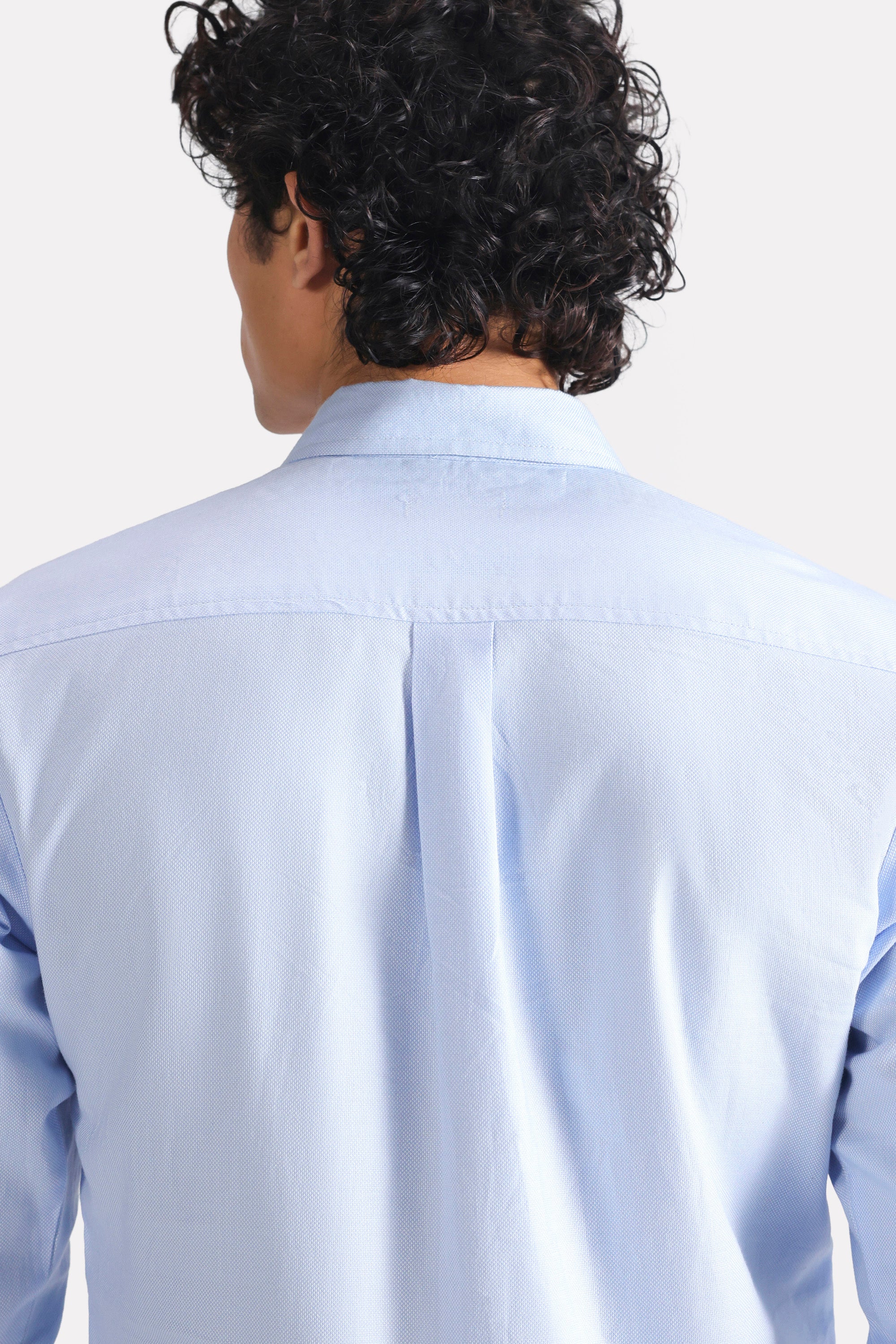 Flat lay of the blue slim fit textured oxford shirt, by SOLA Pakistan.