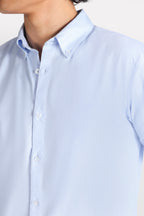 Blue slim fit textured oxford shirt shown in a styled fit, by SOLA Pakistan.