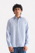 Blue stripe relaxed fit striped shirt in cotton-linen blend, worn by a model, by SOLA Pakistan.