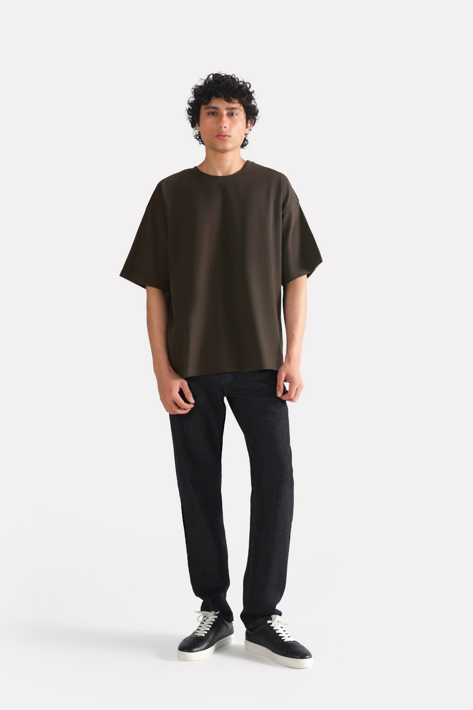 Close-up detail on the brown drop shoulder cotton t-shirt, by SOLA Pakistan.
