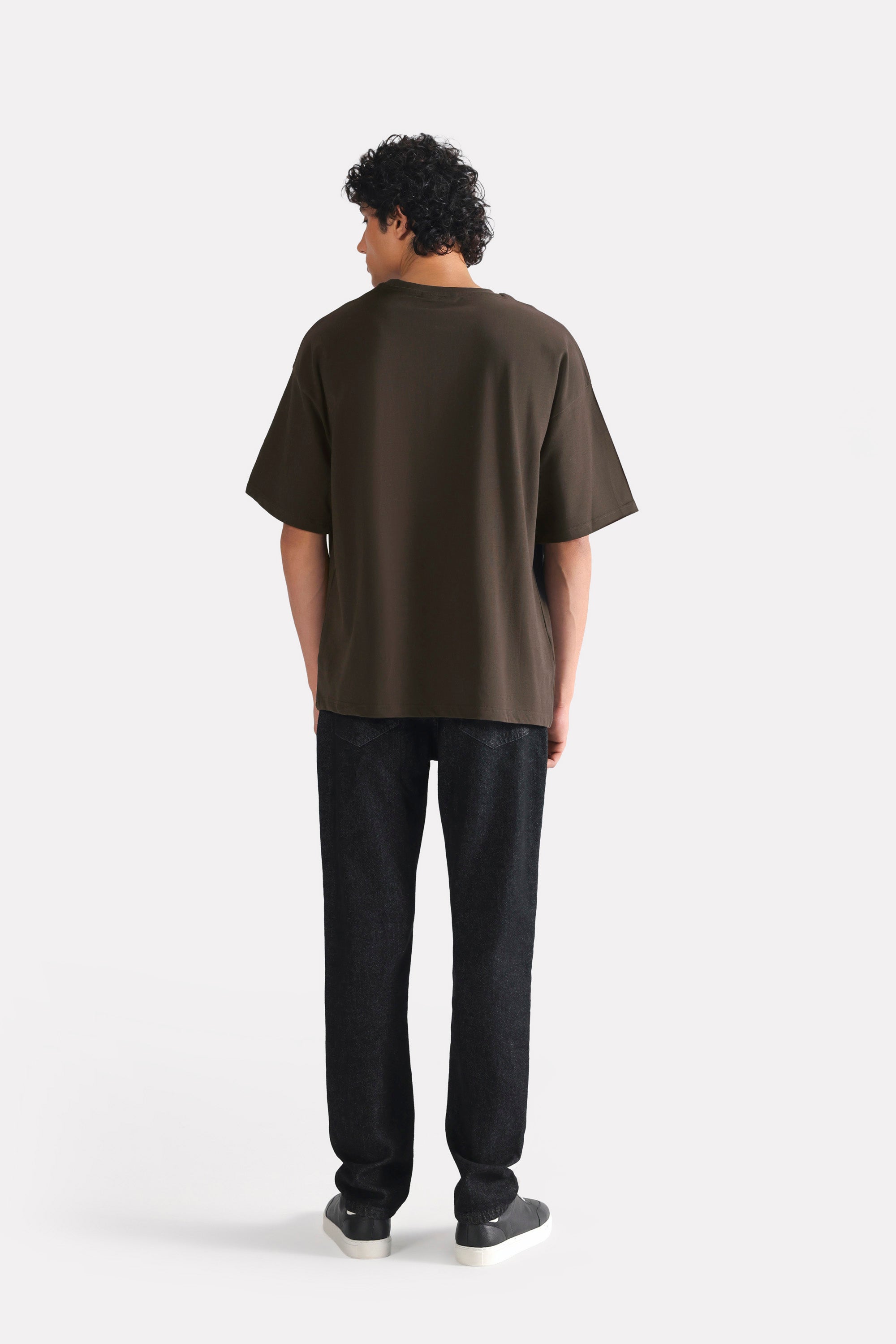 Flat lay of the brown drop shoulder cotton t-shirt, by SOLA Pakistan.