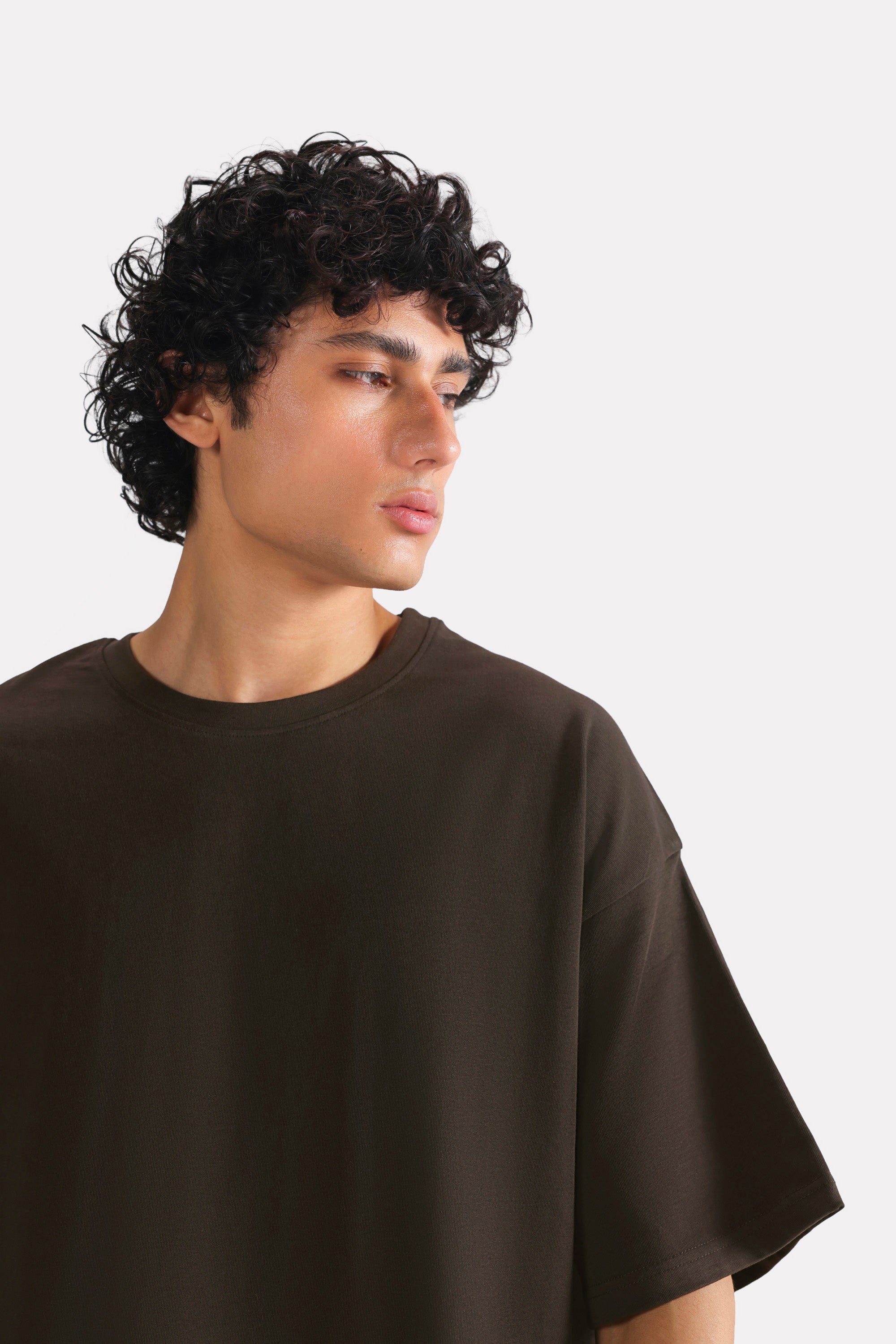 Brown drop shoulder cotton t-shirt shown in a styled fit, by SOLA Pakistan.