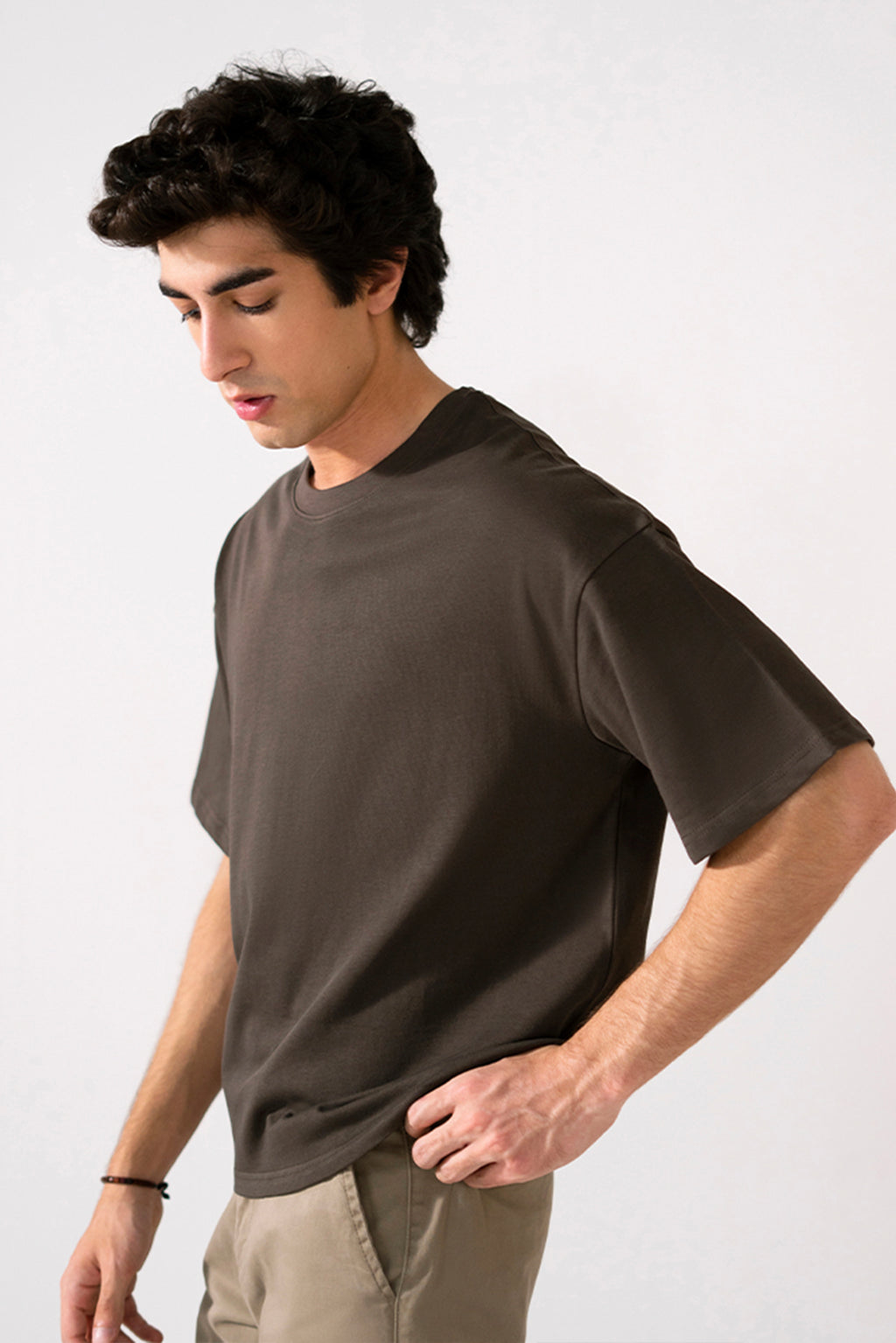 Close-up detail on the brown heavy weight cropped t-shirt, by SOLA Pakistan.