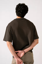 Brown heavy weight cropped t-shirt shown in a styled fit, by SOLA Pakistan.