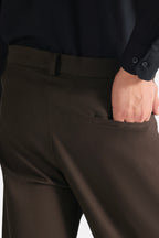 Brown (turkish coffee) straight fit cotton trouser shown in a styled fit, by SOLA Pakistan.