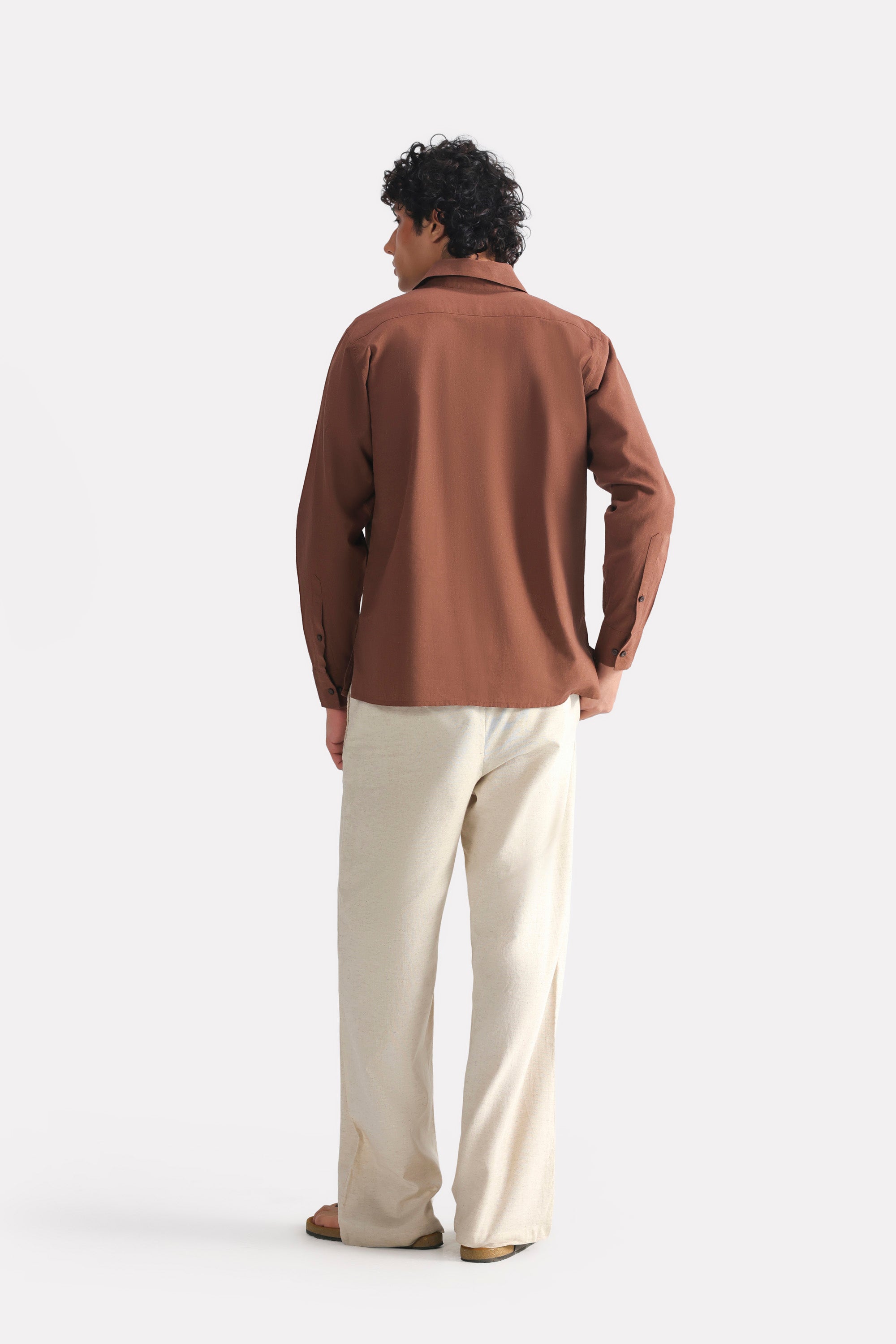 Flat lay of the chocolate brown pop over half-placket shirt, by SOLA Pakistan.