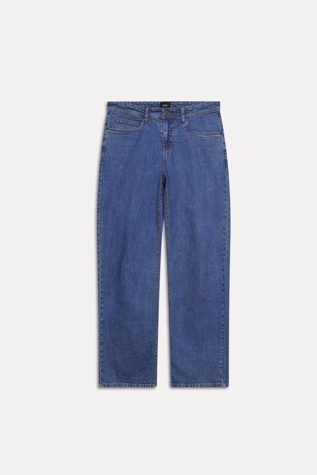 Flat lay of the dark blue loose fit jeans, by SOLA Pakistan.