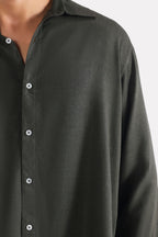 Close-up detail on the dark green (charcoal green) state flow button down shirt, by SOLA Pakistan.