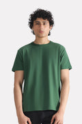 Dark green regular fit crew neck t-shirt in cotton, worn by a model, by SOLA Pakistan.