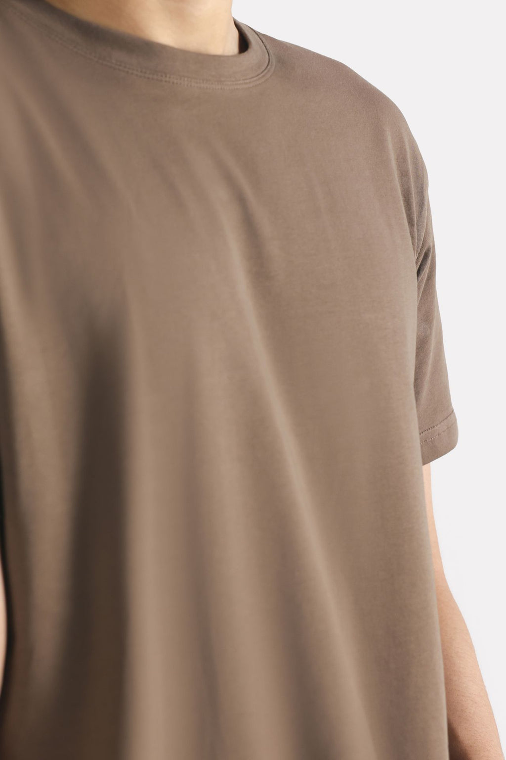 Flat lay of the dark grey (darkmole) regular fit crew neck t-shirt, by SOLA Pakistan.