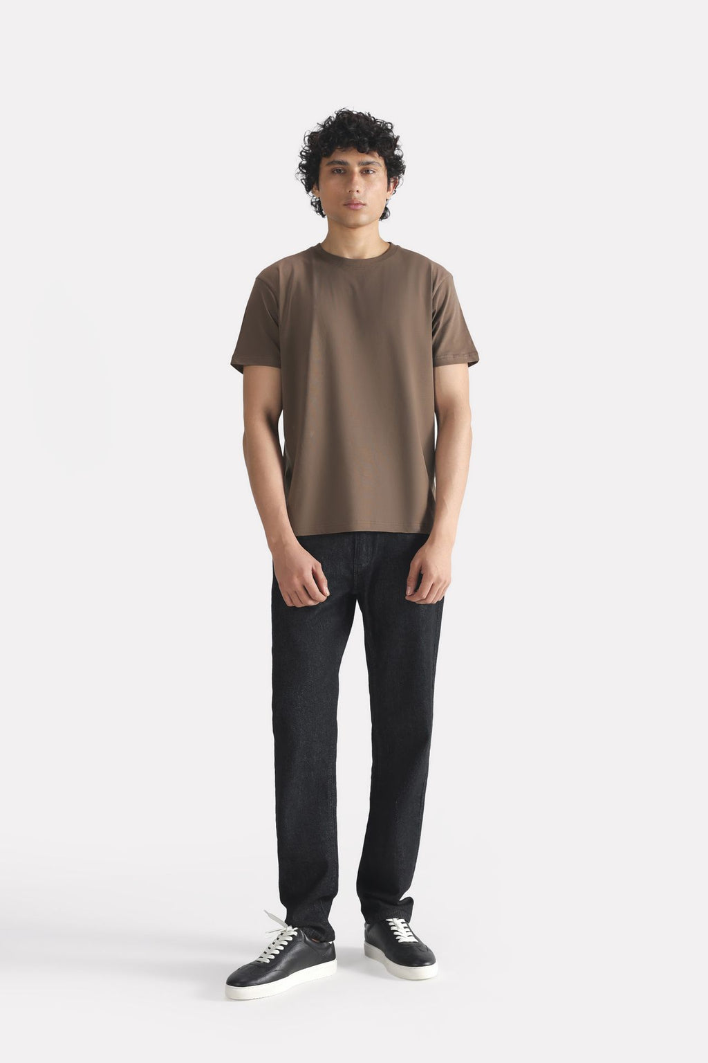 Dark grey (darkmole) regular fit crew neck t-shirt shown in a styled fit, by SOLA Pakistan.