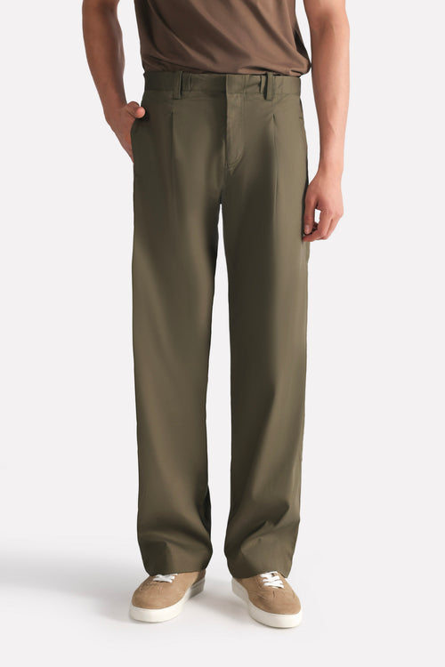 Dark olive barrel-leg pleated trouser, full styled look, by SOLA Pakistan.