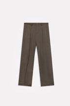 Texture and fabric detail, dark olive barrel-leg pleated trouser, by SOLA Pakistan.